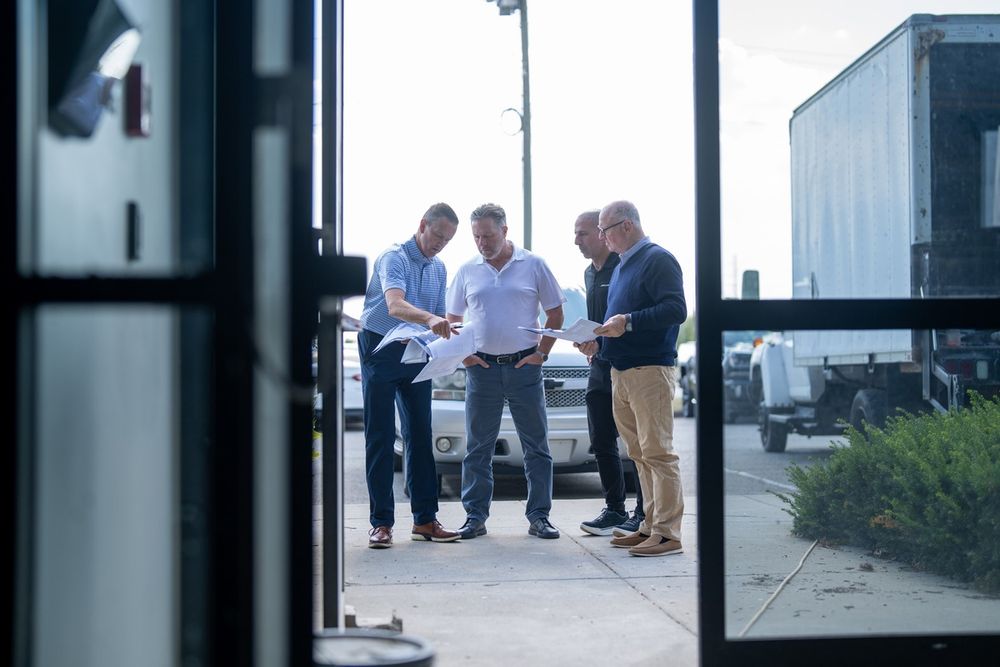 Arrow McLaren President Kevin Thimjon, McLaren Racing CEO Zak Brown, Arrow McLaren Team Principal Tony Kanaan and McLaren Racing board member Jeff Urwin