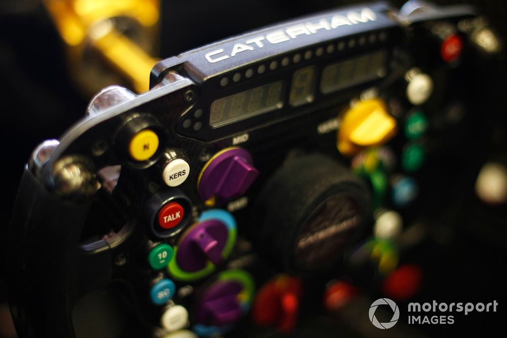 Caterham CT01 steering wheel, showing KERS and radio buttons