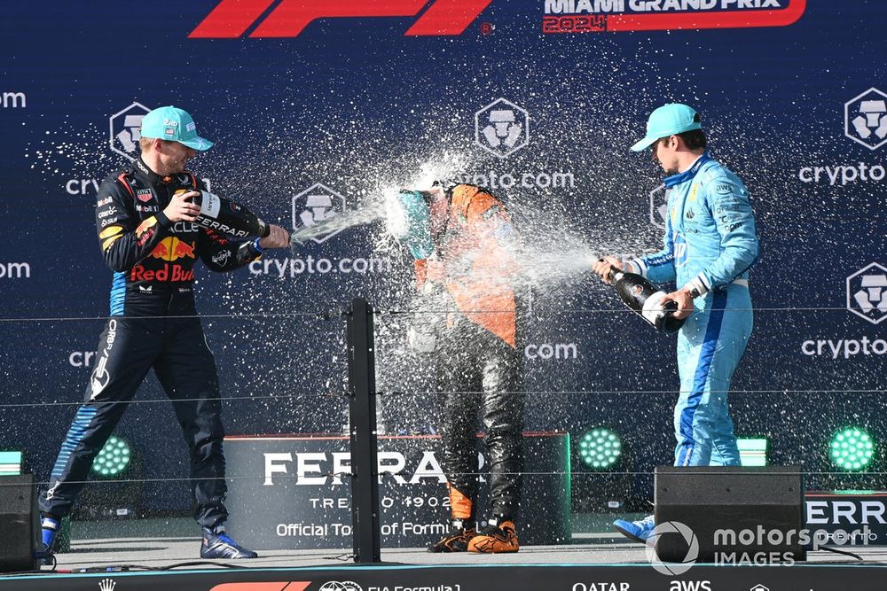 Max Verstappen, Red Bull Racing, 2nd position, Lando Norris, McLaren F1 Team, 1st position, Charles Leclerc, Scuderia Ferrari, 3rd position, celebrate on the podium with Champagne