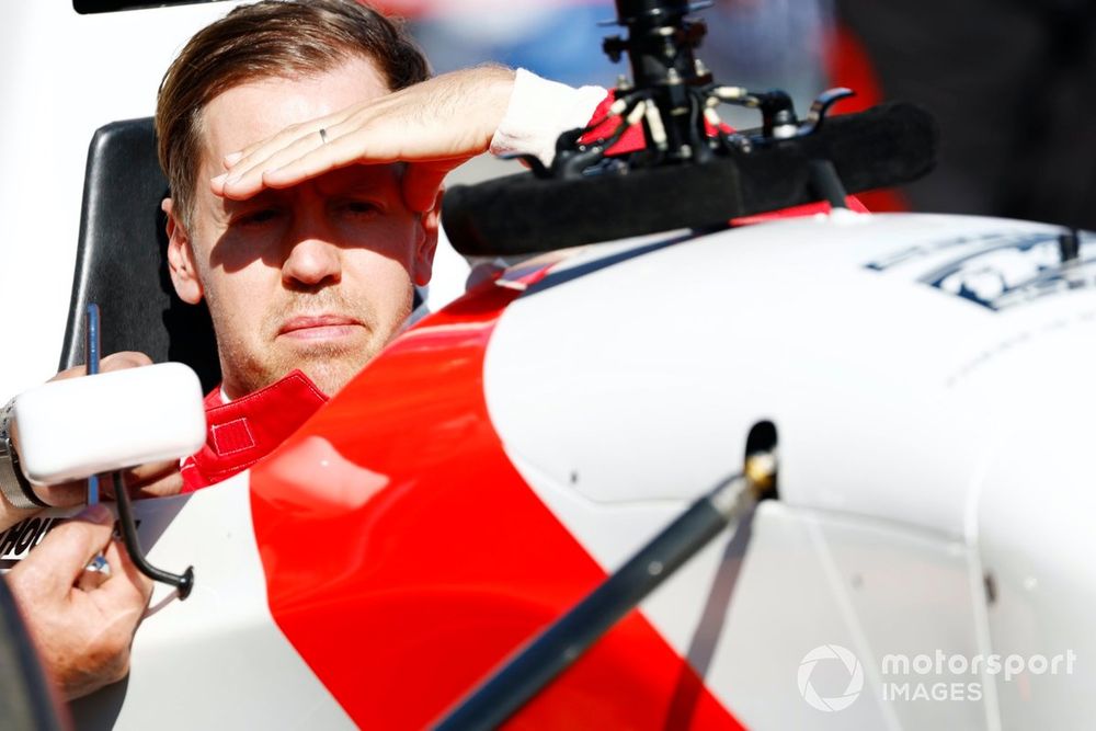 Sebastian Vettel prepares to drive Ayrton Senna's McLaren MP4/8