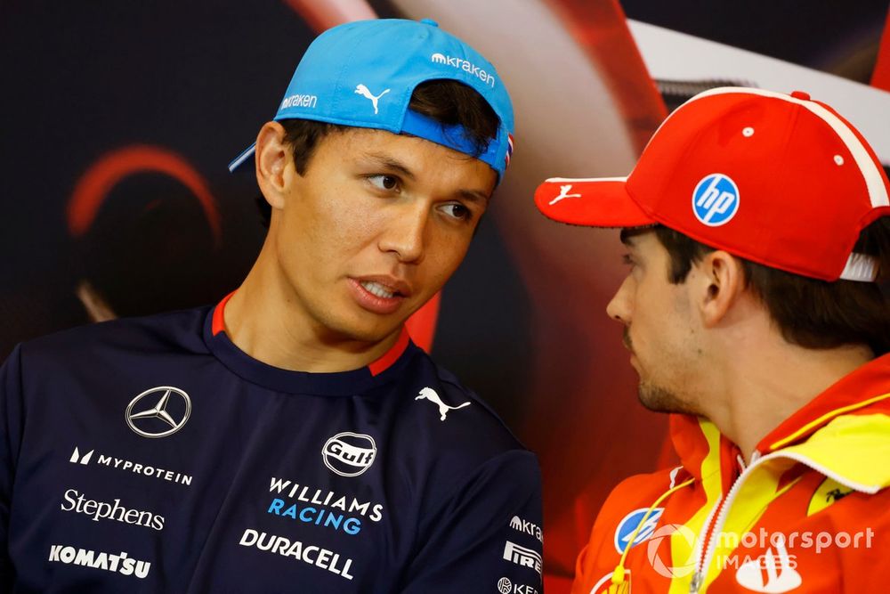 Alex Albon, Williams Racing, talks with Charles Leclerc, Scuderia Ferrari, at a Press Conference