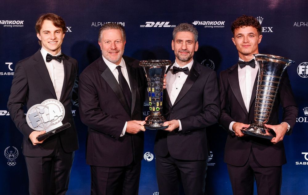 Lando Norris, McLaren, Oscar Piastri, McLaren, Andrea Stella, Team Principal of McLaren and Zak Brown, Chief Executive Officer of McLaren