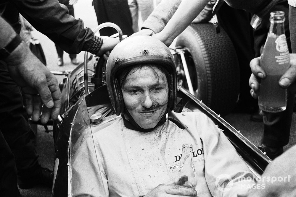 Runner-up Bruce McLaren rehydrates after managing to coax his running-on-fumes Cooper home 