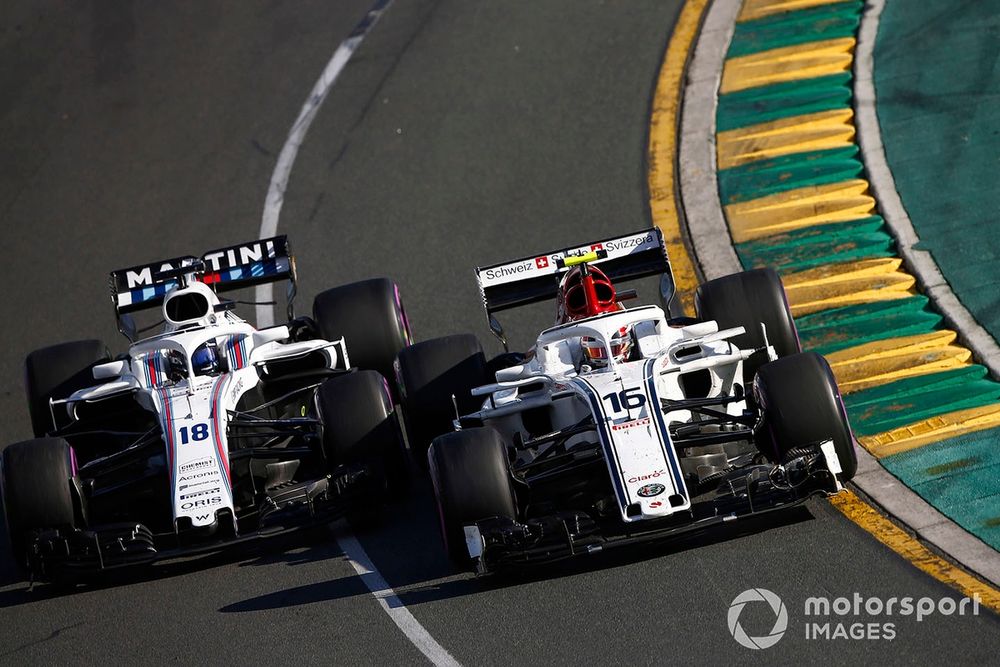 Charles Leclerc, Sauber C37 Ferrari, battles with Lance Stroll, Williams FW41 Mercedes
