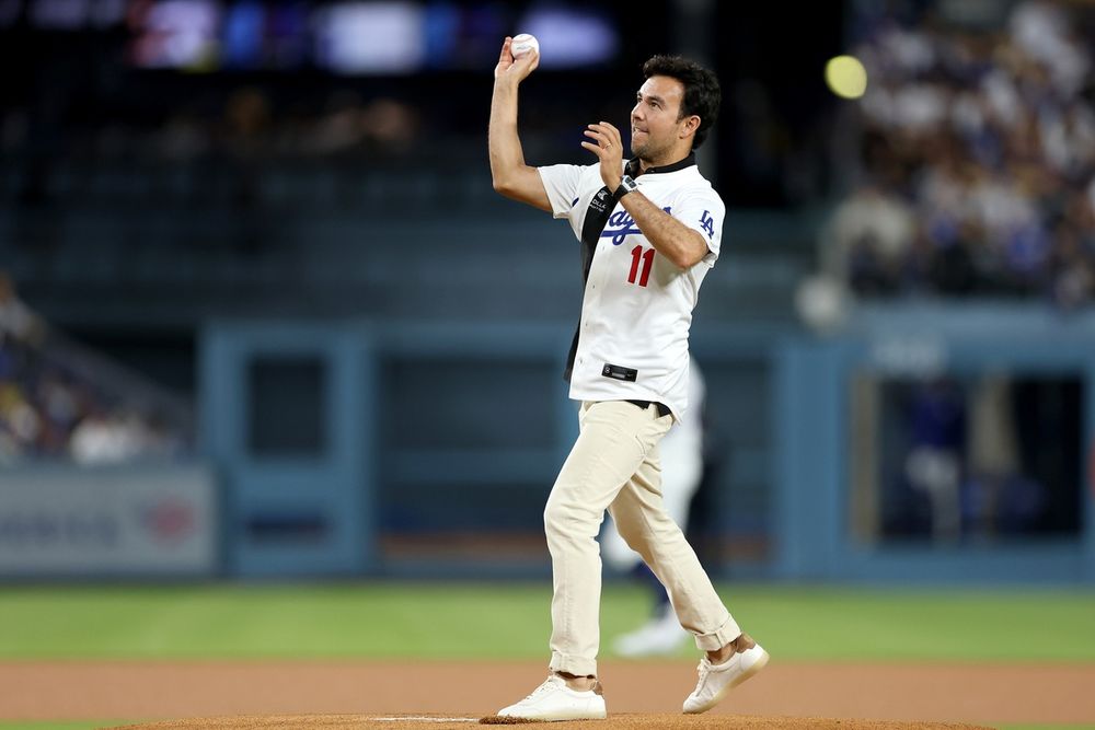 Cadillac 2026 race driver Sergio Perez throwing the first pitch at the LA Dodgers