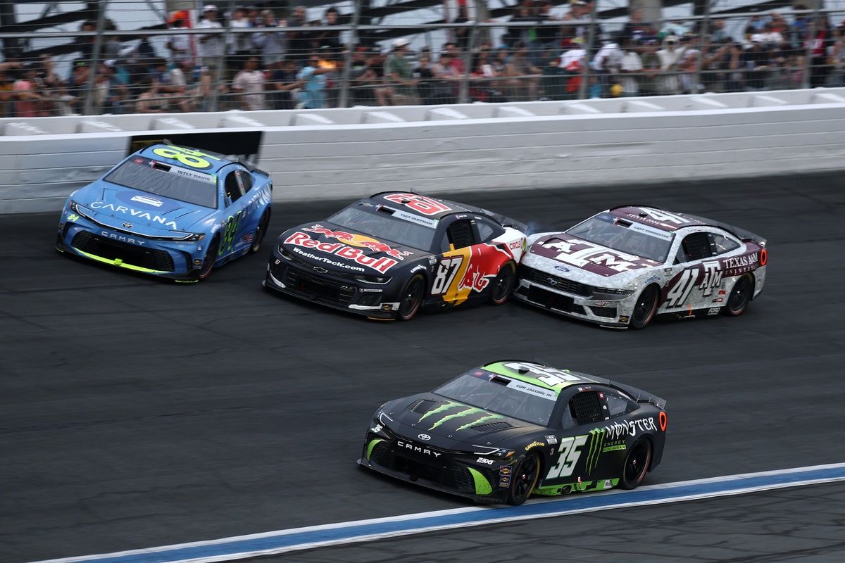Connor Zilisch racing alongside Jimmie Johnson and​ Cole Custer during the Coca-Cola 600.