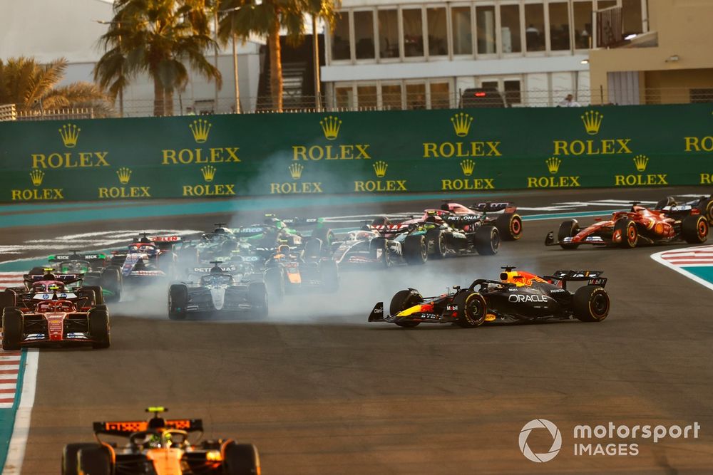 Lando Norris, McLaren MCL38, as Max Verstappen, Red Bull Racing RB20, spins after contact at the start