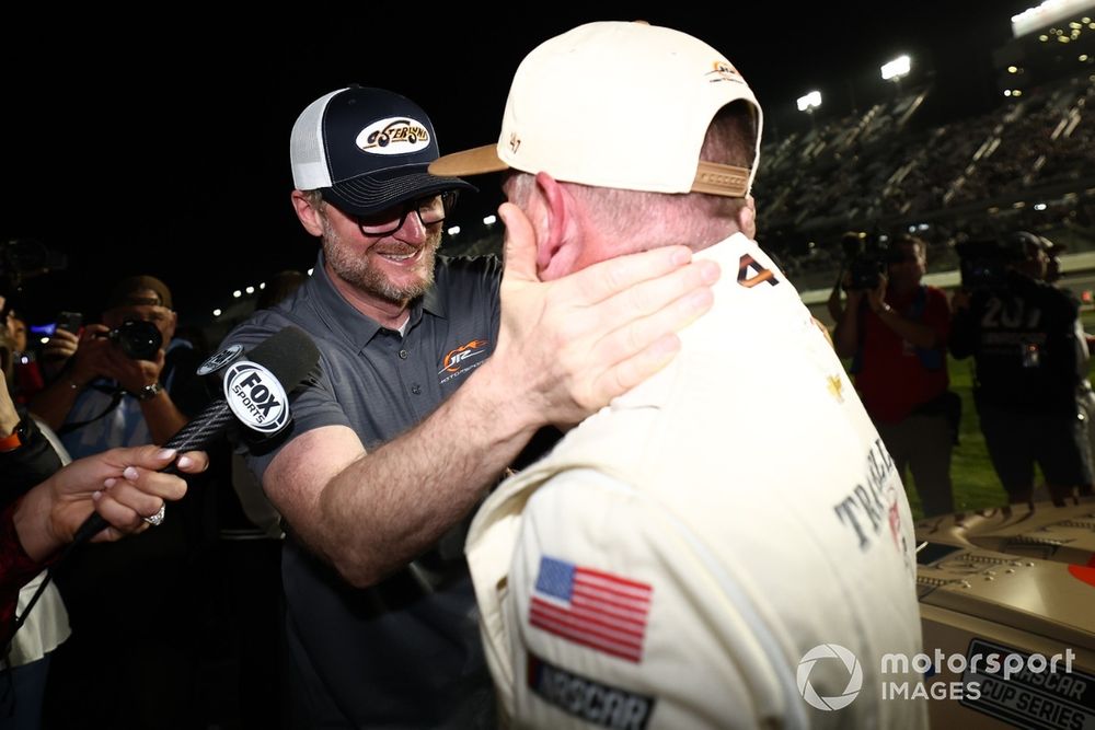 Dale Earnhardt Jr. celebrates with Justin Allgaier after qualifying for the 2025 Daytona 500