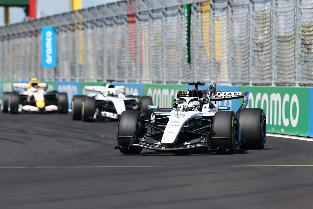 Alexander Albon, Williams, leads Sergio Perez, Cadillac