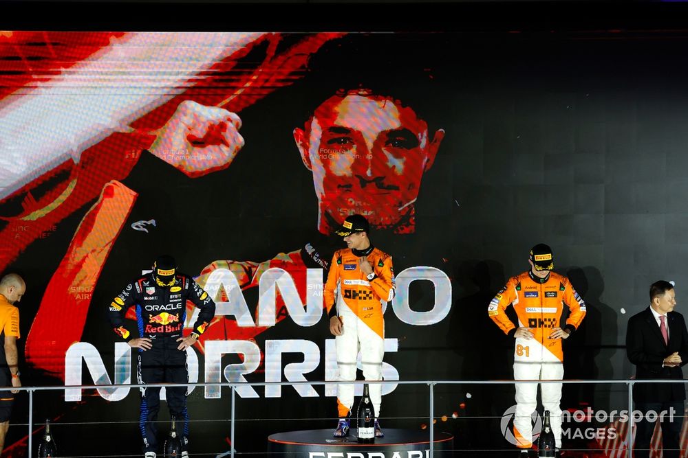 Max Verstappen, Red Bull Racing, 2nd position, Lando Norris, McLaren F1 Team, 1st position, and Oscar Piastri, McLaren F1 Team, 3rd position, on the podium