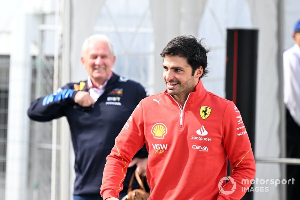 Helmut Marko, Consultant, Red Bull Racing and Carlos Sainz, Scuderia Ferrari, arriving in the paddock
