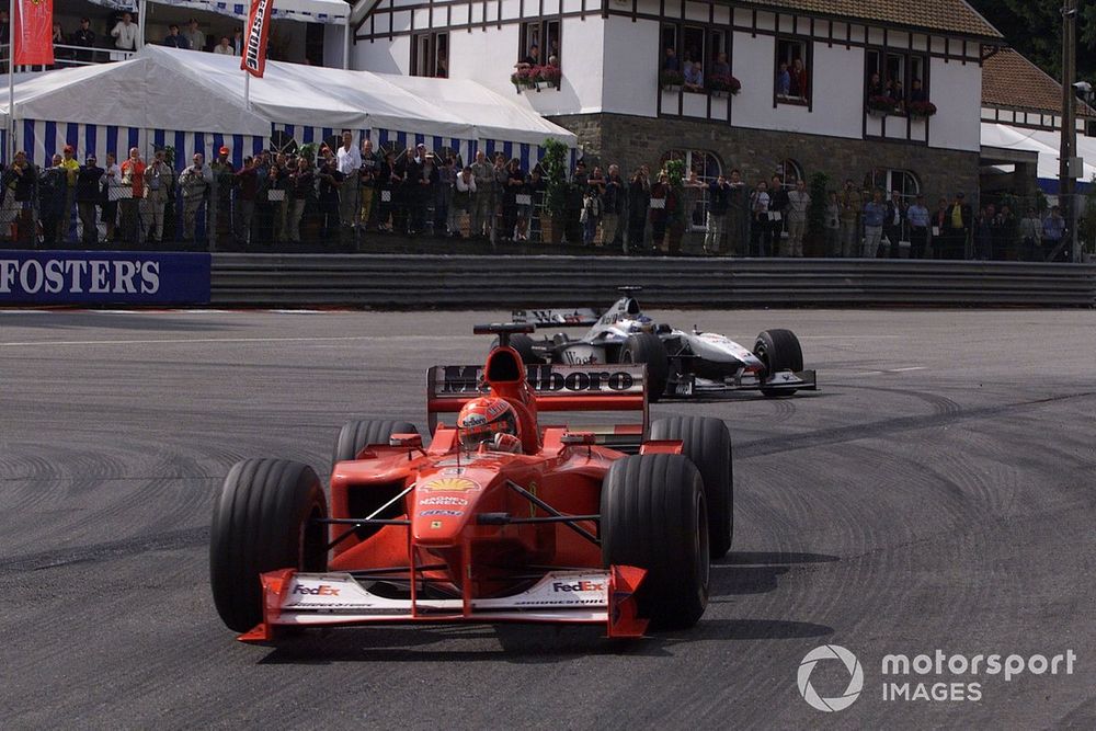 Michael Schumacher, Ferrari closely followed by Mika Hakkinen, McLaren