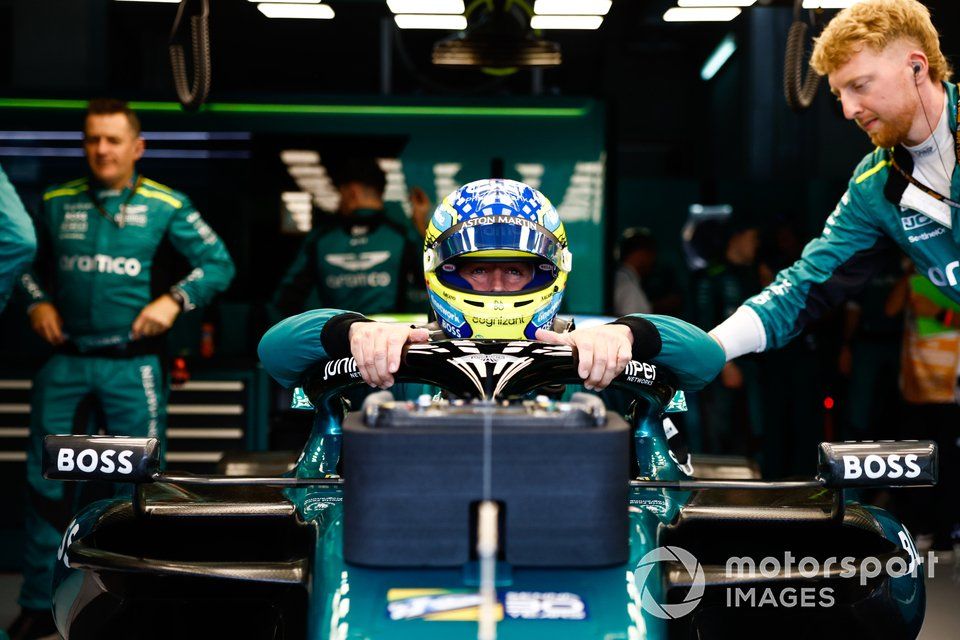 Fernando Alonso, Aston Martin F1 Team, settles into his seat