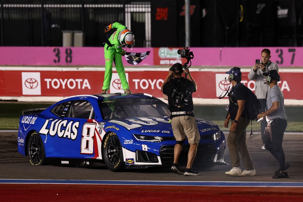 Brexton Busch takes a bow after driving his father Kyle Busch's No. 8 RCR Chevrolet