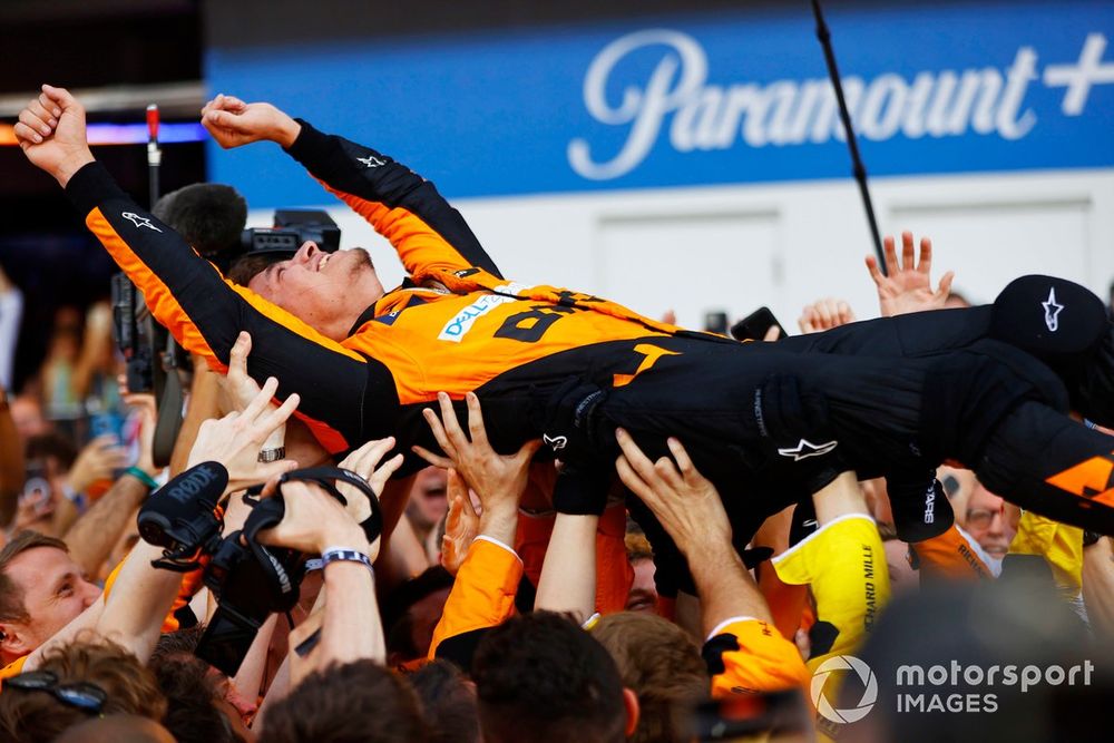 Norris celebrates with his McLaren team