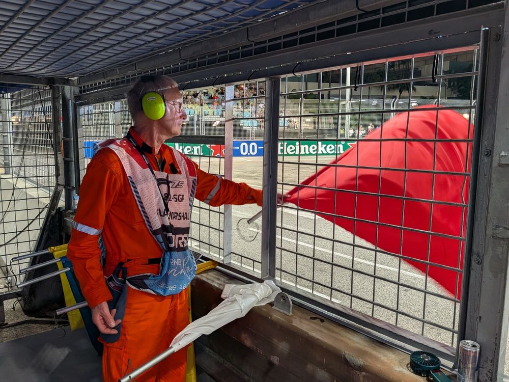 Dom, 71, waves the red flag