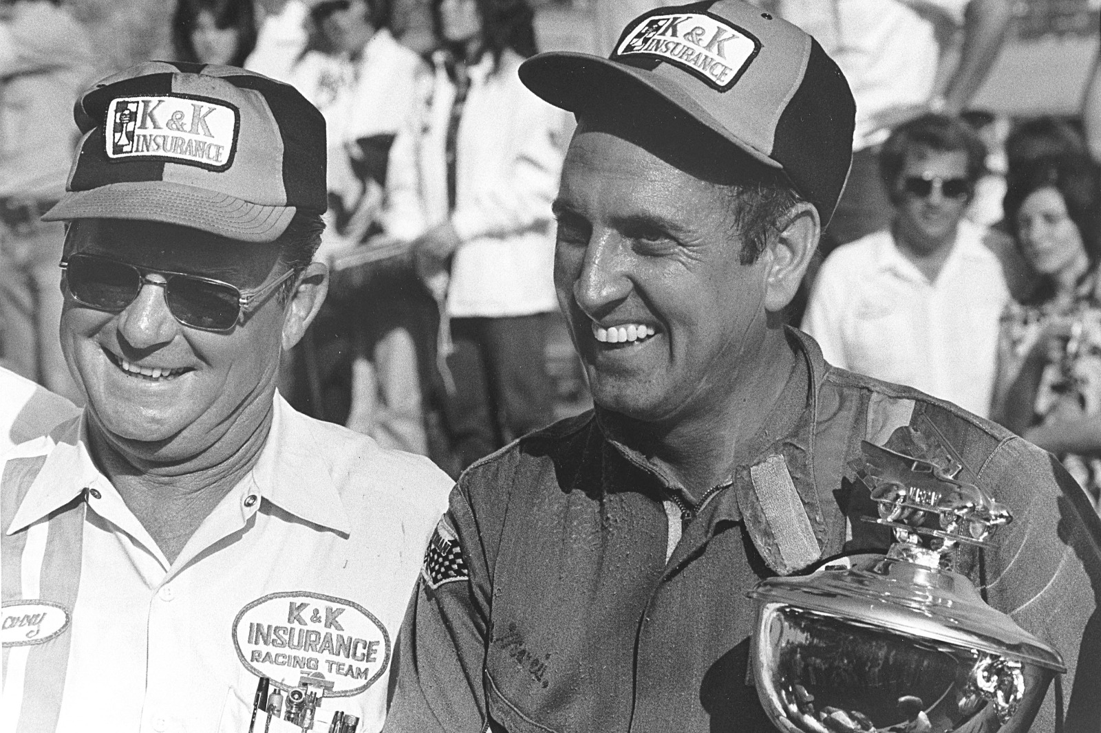 Driver Dave Marcis (R) celebrates in victory lane at Martinsville Speedway with his crew chief Harry Hyde