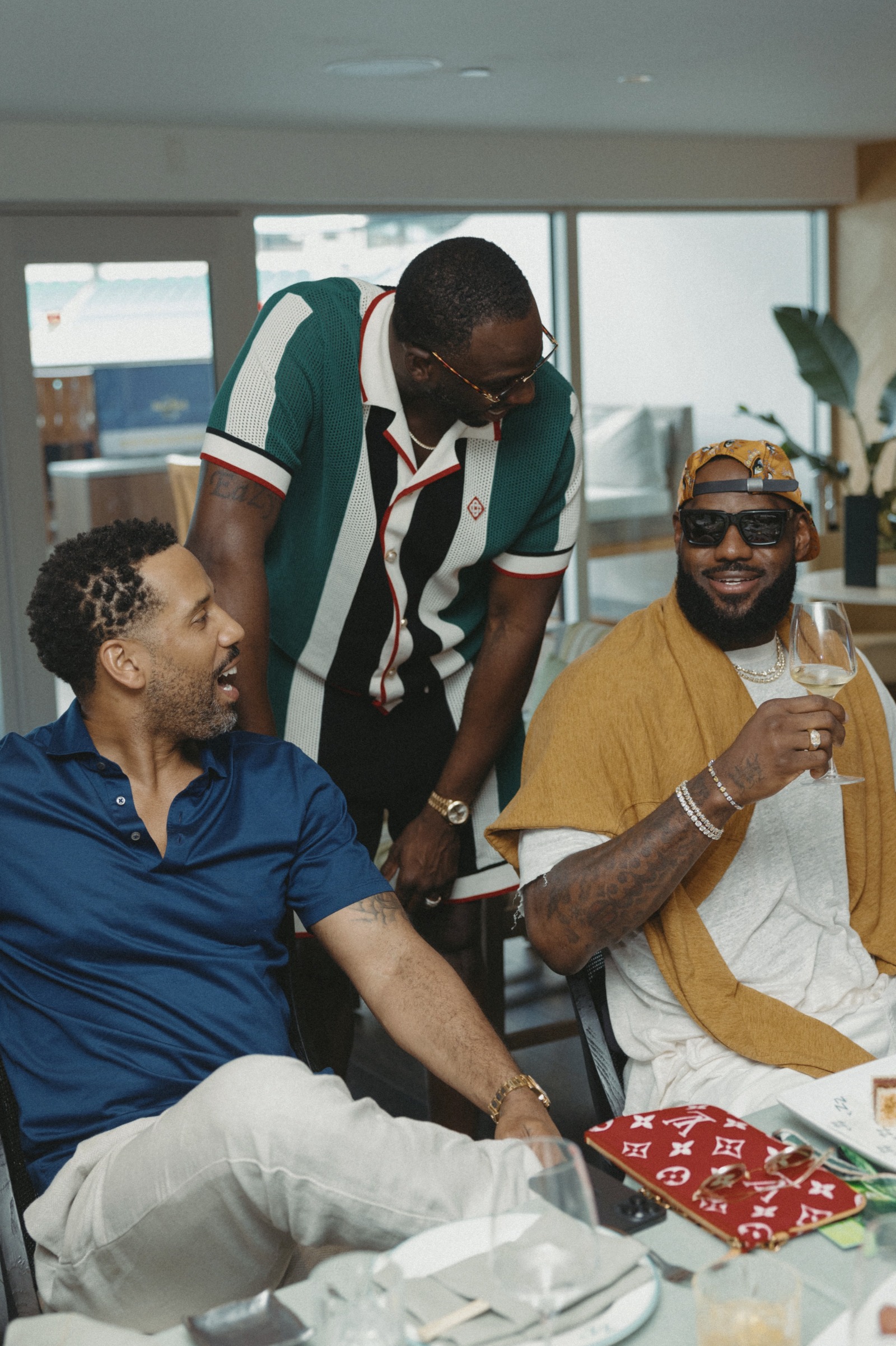 Maverick Carter, Draymond Green and LeBron James enjoy the Palm Club.