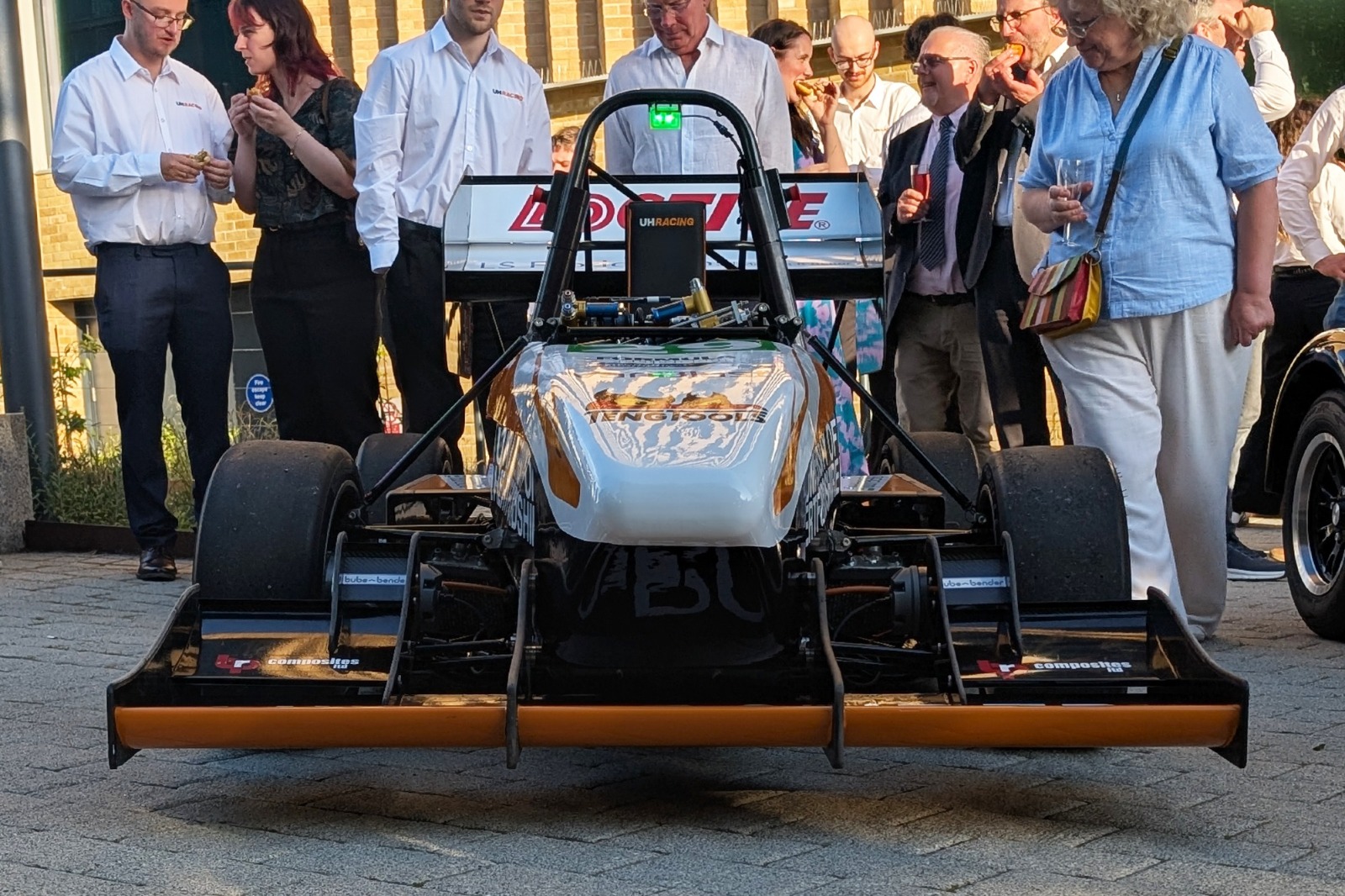 Guests admire the students' latest handiwork - which will compete at Silverstone in July